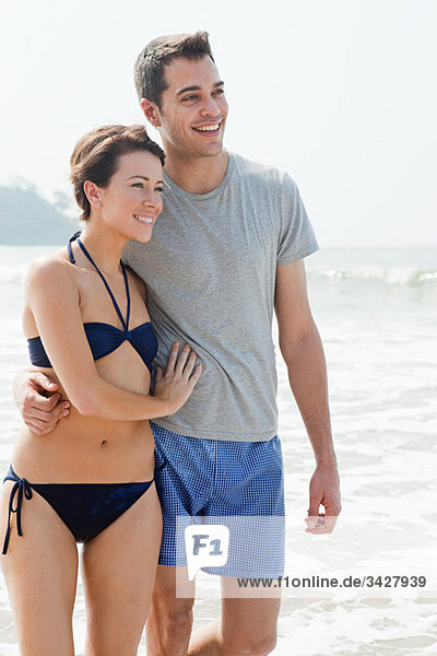 Happy couple by the sea