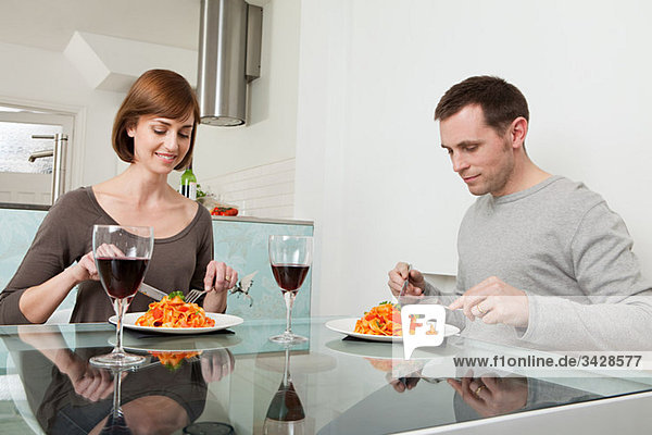 Couple having meal and wine