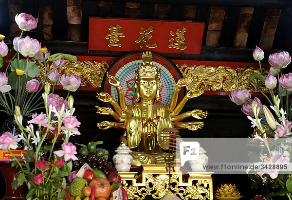 Buddhist altar at the One Pillar Pagoda (Chua Mot Cot)  Hanoi  Vietnam