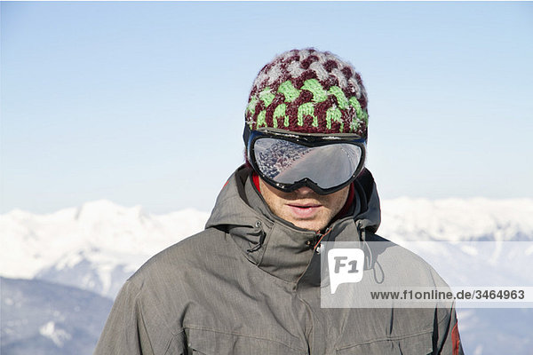 Portrait of young man with ski goggles