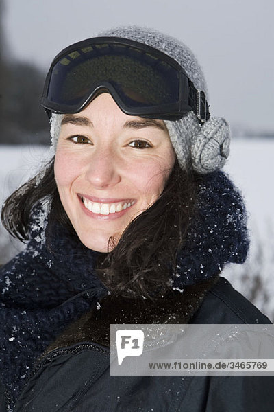 A woman outdoors in winter  head and shoulders  portrait