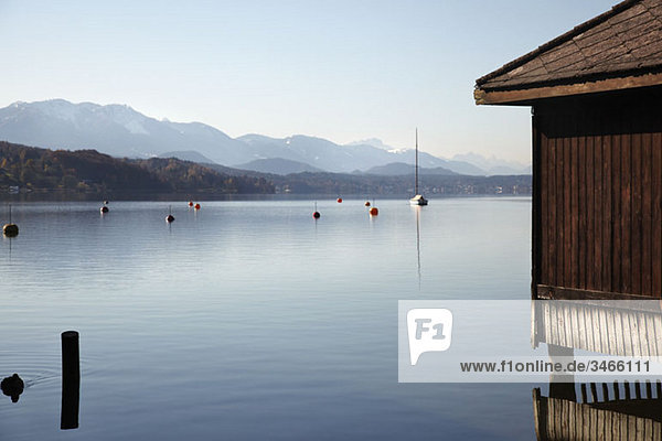 View of lake and mountains  Woerthersee  Carinthia  Austria