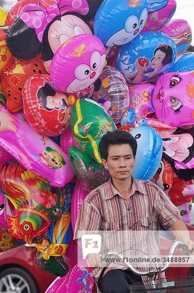 Ho Chi Min City (Vietnam): a balloon seller on his bicycle