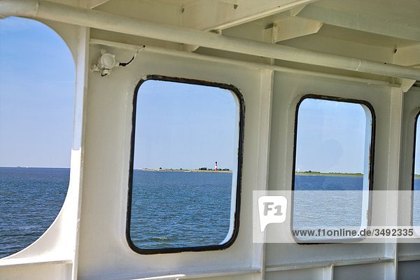 View from a ferry on a lighthouse in Pellworm  Schleswig-Holstein  Germany