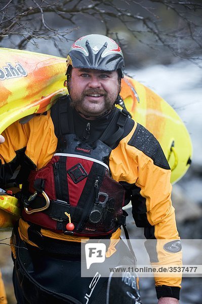 Man carrying his kayak  Sweden