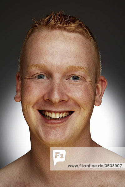 Man smiling in front of camera