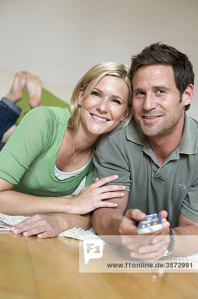 Couple at home watching TV
