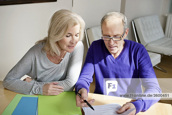 Couple sorting out bills