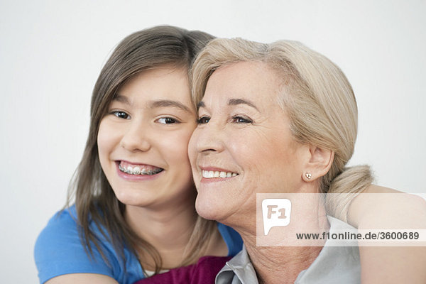 Close-up of a woman smiling with her granddaughter
