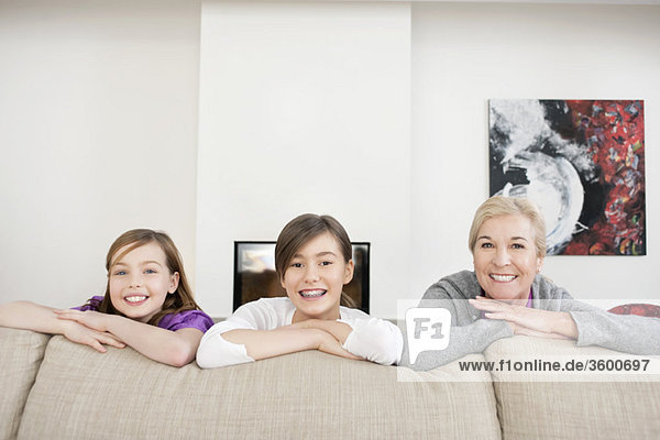 Portrait of a woman smiling with her granddaughters