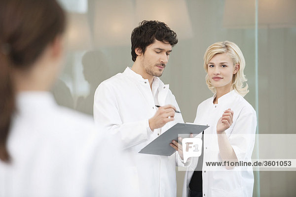 Doctor discussing with her colleague