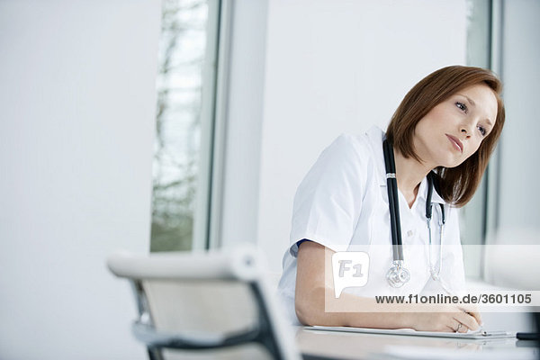 Female doctor working in an office