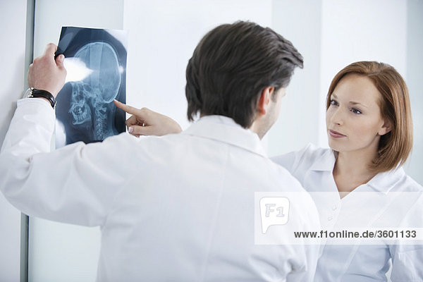Two doctors examining an x-ray