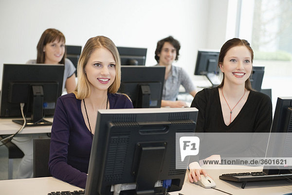 Business executives smiling in a training class