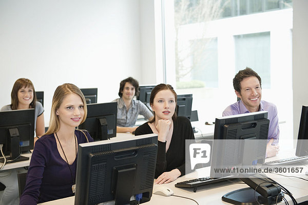 Business executives smiling in a training class