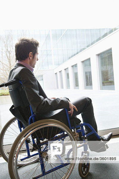 Disabled businessman sitting in a wheelchair