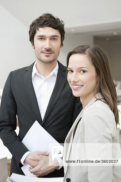 Portrait of two business executives smiling