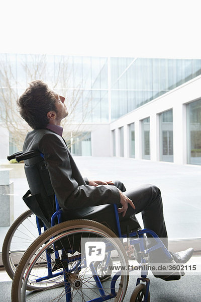 Disabled businessman sitting in a wheelchair