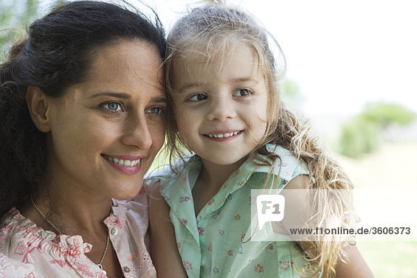 Mother and daughter together outdoors  portrait