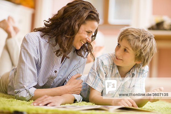 Mother and son reading journals