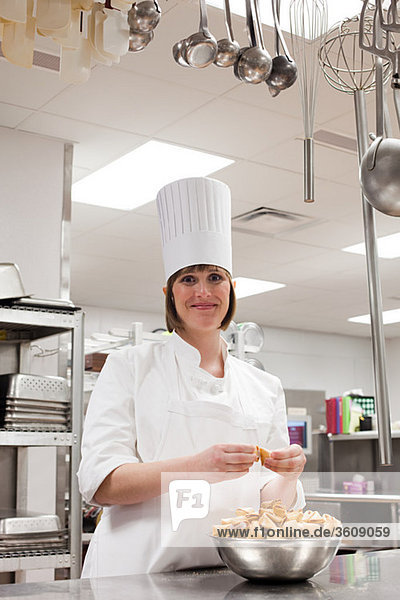 Female chef working in commercial kitchen