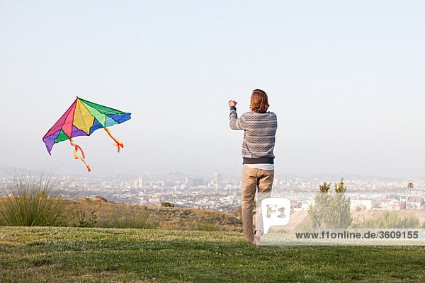 Young man flying a kite
