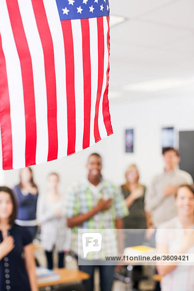 High school students swearing allegiance to the American flag