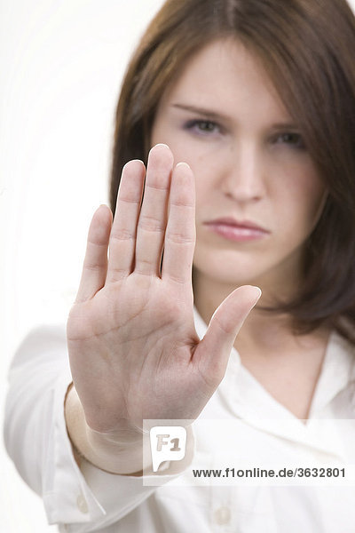 Woman making a gesture to reject or fend off