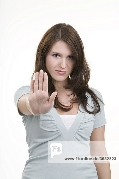 Woman making a gesture to reject or fend off
