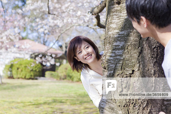 Young couple playing in park