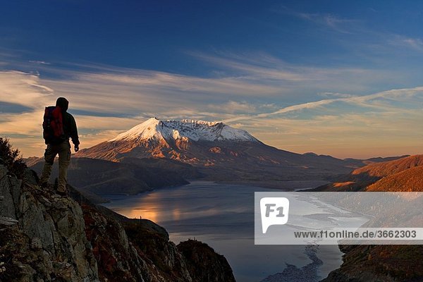 Hiker is enjoying view of autumn Mt St Helens volcano from near Independence pass