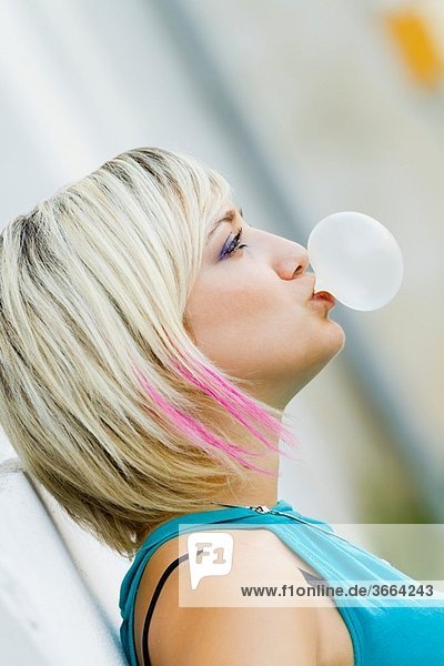 Blowing a bubble gum
