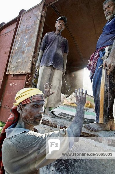 Worker unloading cement bags from train  from Jessore to Dhaka  Bangladesh