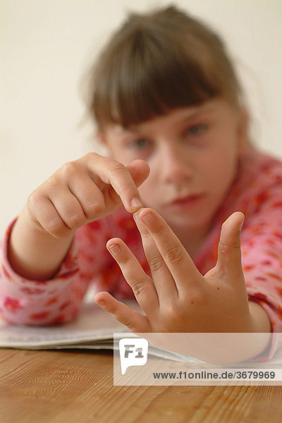 Child counting on her fingers