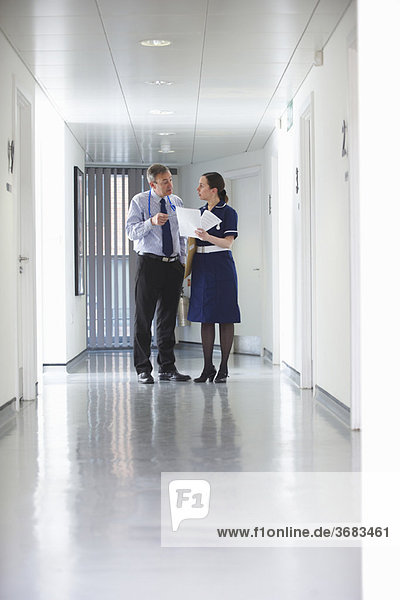 Doctor and Nurse talking in corridor