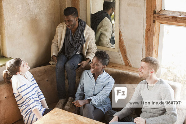 Four friends relaxing at a table