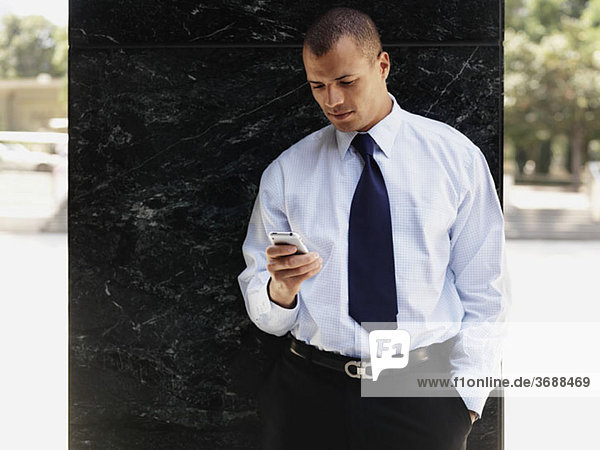 A businessman using a smart phone