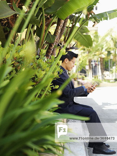 A businessman using a smart phone