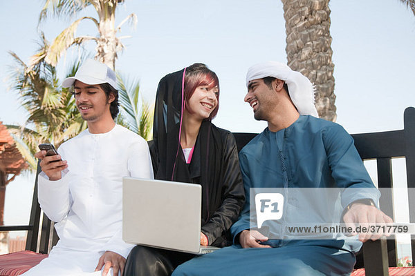 Middle Eastern people using laptop