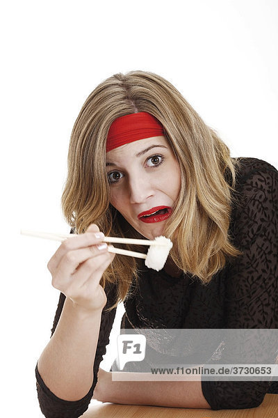 Young woman disgusted of sushi