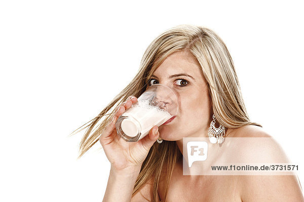 Young woman drinking a buttermilk shake
