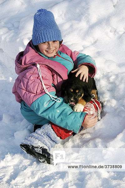 Girl  10 years  with puppy in the snow  Sidonie  White Carpathian Mountains Protected Landscape Area  Bile Karpaty  Czech Republic  Europe