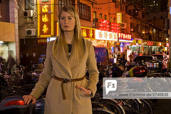 Young woman in the nightlife quarter of Shanghai  China  Asia