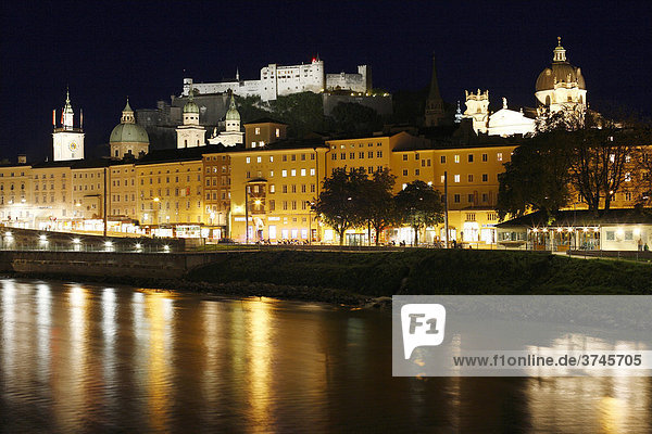 View over Salzach of the historic district of Salzburg with town hall  cathedral  Kollegienkirche Church and Festung Hohensalzburg Fortress  night shot  Salzburg  Austria  Europe