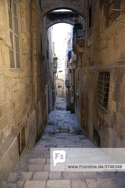 Narrow alley on St. Lucia Street  Valletta  Malta  Europe