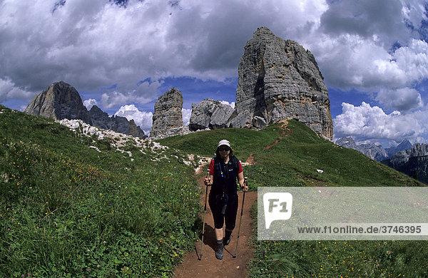 Female hiker in front of the Cinque Torri  Cortina d'Ampezzo  Ampezzo Dolomites  Italy  Europe