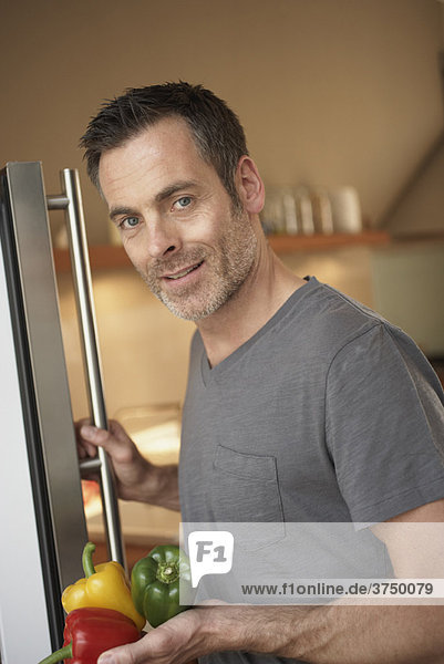Man standing in front fridge