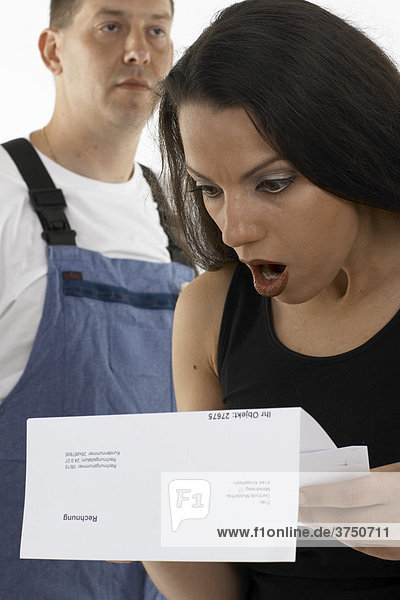 Woman shocked  appalled at the bill given to her by a handyman  workman (back)