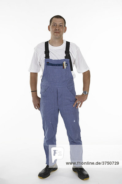 Workman wearing overalls and safety boots