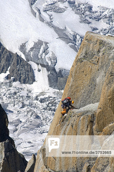 Mountain climber climbing the rockface of Mt. Aiguille du Midi  Mont Blanc Massif  Chamonix  France